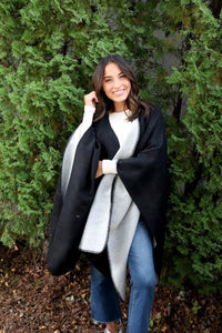 Reversible women's black and gray shawl poncho style front.