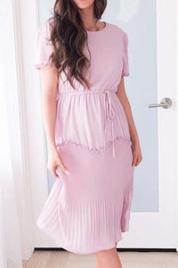 Woman wearing light pink plush Tea N Rose modest midi short sleeve dress front.