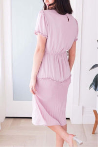 Woman wearing light pink plush Tea N Rose modest midi short sleeve dress back.