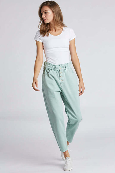 Woman wearing mint green relax fit pants front.