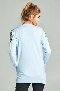 Woman wearing sky blue hip length long sleeve cardigan back