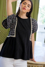Woman wearing black knit tweed short split short sleeve THML top front.