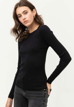 Women's black fitted long sleeve ribbed knitted shirt side.
