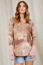 Women in long sleeve pink brown cream colored tie dye lightweight shirt front.