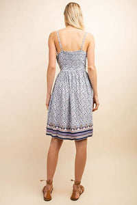 Back View of Sleeveless Button-Up Blue Floral Midi Dress. Button-up front design for a versatile and chic look.