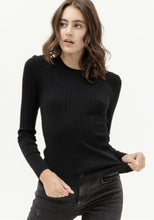 Women's black ribbed fitted sweatshirt front.