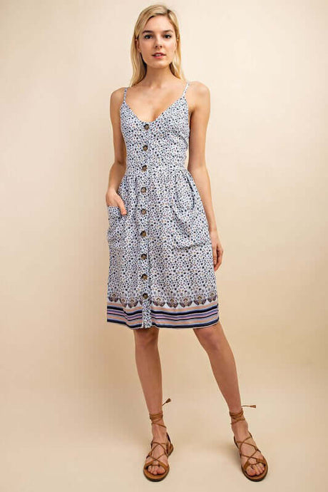Sleeveless Button-Up Blue Floral Midi Dress - Front View. All-over floral pattern adds charm to this elegant dress.