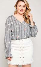 Modest plus women's wrap top flower print shirt with long sleeves and ruffle details front.