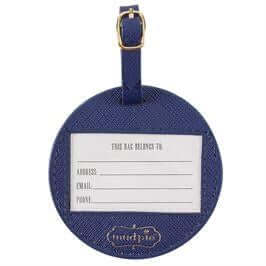 Round blue faux leather luggage tag with gold writing  I'm Outta Here