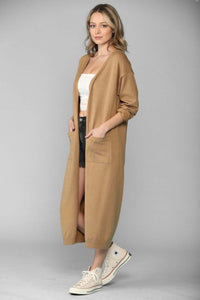 Camel color maxi length soft knitted women's cardigan with two front pockets duster style side.