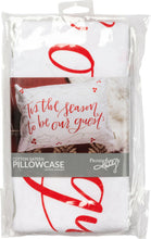 White pillowcase with "Tis The Season" red graphic lettering on front.